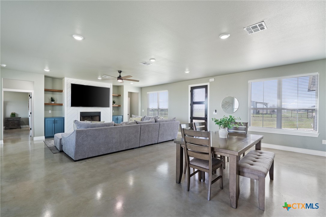 15073 Armstrong Ests Road Salado, TX 76571 - Photo 18 of 44 a living room with furniture and a flat screen tv