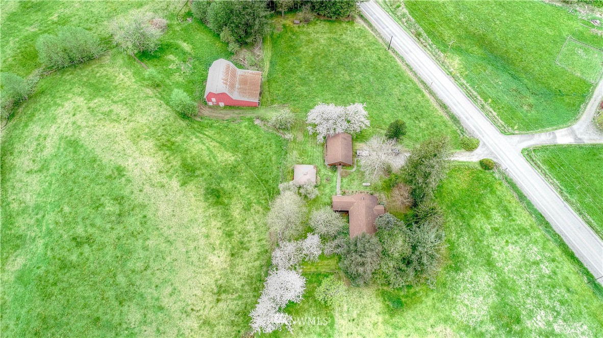 4079 South Pass Road Everson, WA 98247 - Photo 3 of 35 an aerial view of residential house with outdoor space and trees all around