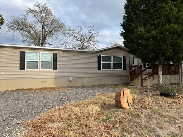 a house view with a backyard space