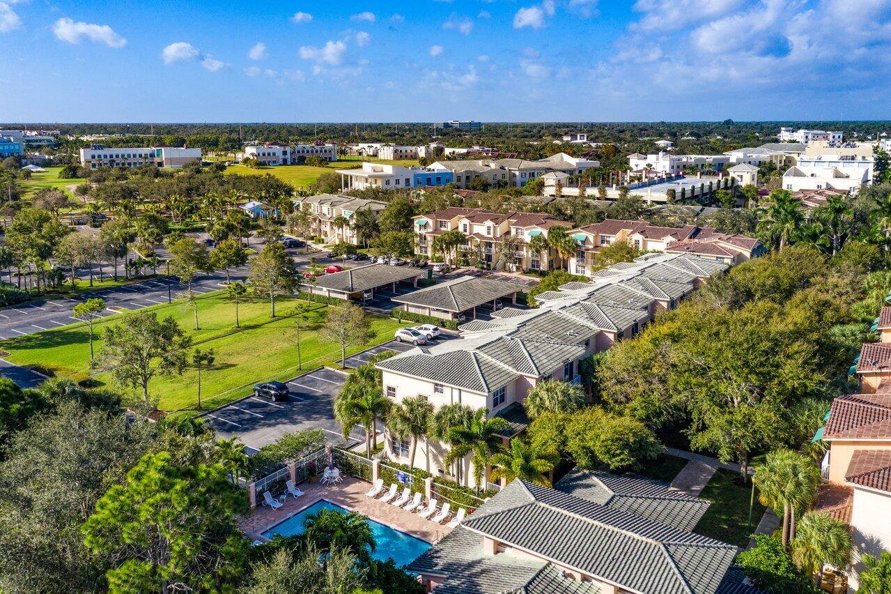 1209 Main Street, Unit 302 Jupiter, FL 33458 - Photo 33 of 35 a view of a city with lots of residential buildings ocean and mountain view in back