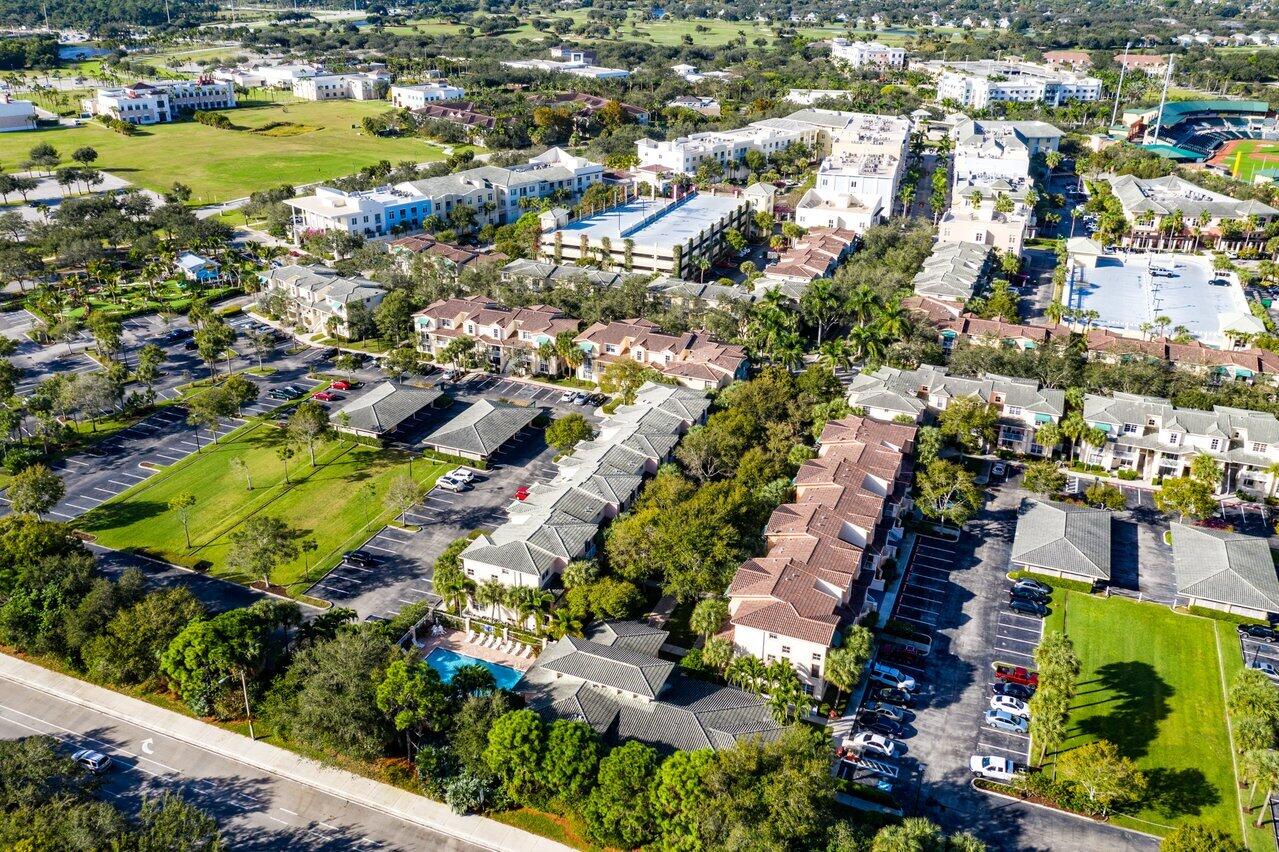 1209 Main Street, Unit 302 Jupiter, FL 33458 - Photo 34 of 35 an aerial view of residential houses with outdoor space