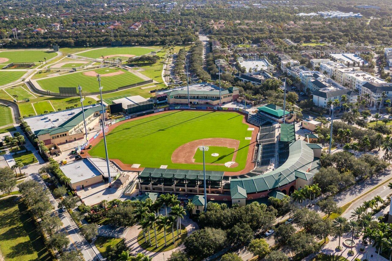 1209 Main Street, Unit 302 Jupiter, FL 33458 - Photo 35 of 35 an aerial view of a swimming pool with outdoor seating and yard