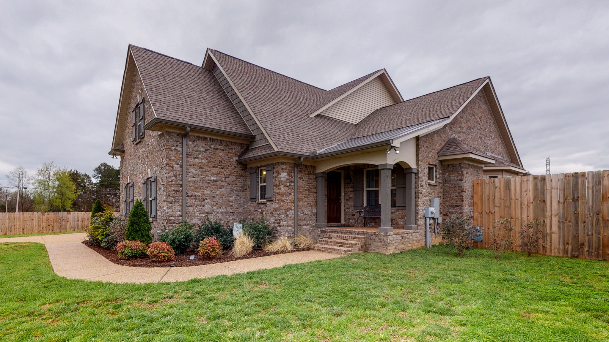 a front view of a house with garden
