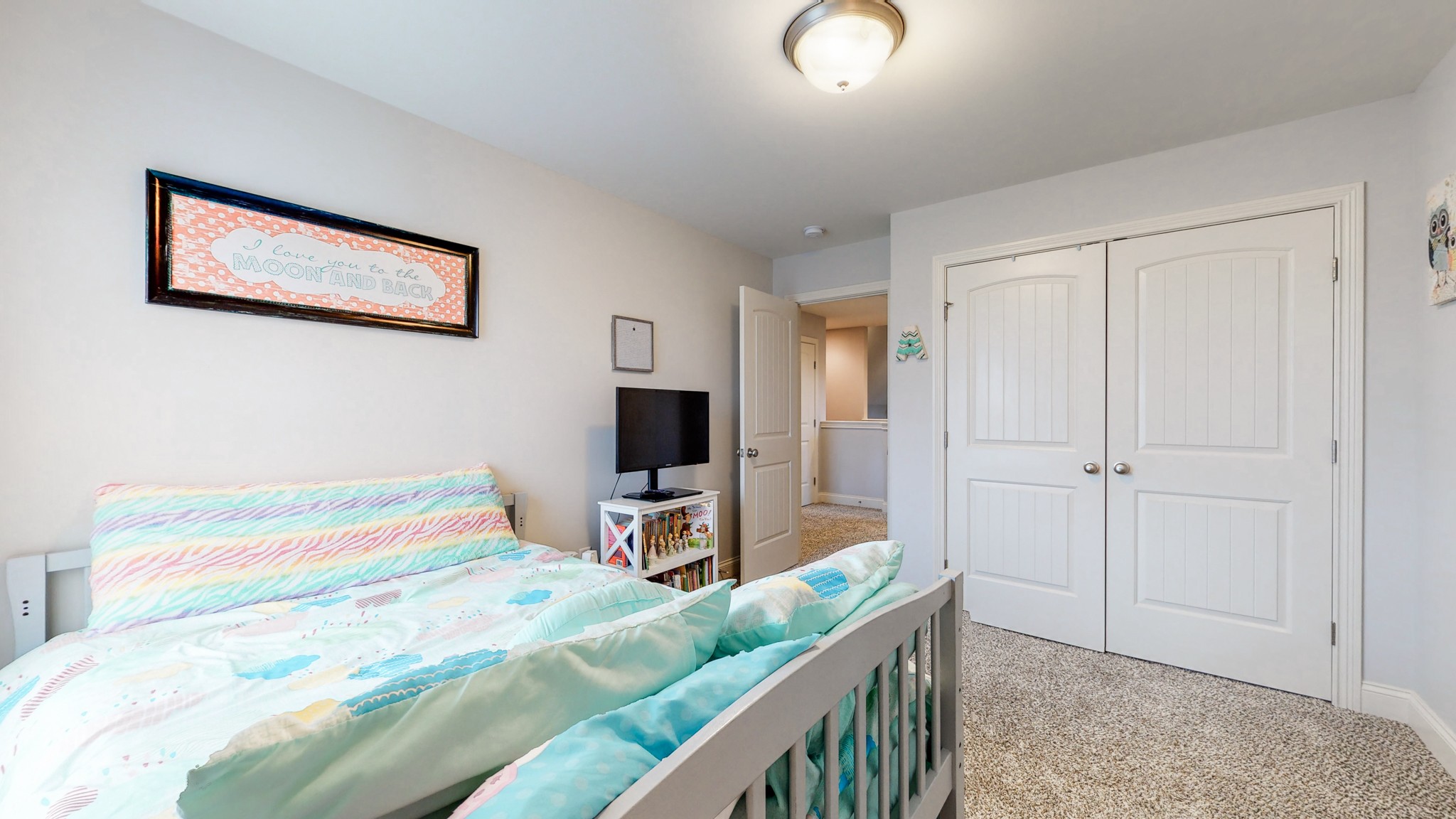 6620 Murfreesboro Road Lebanon, TN 37090 - Photo 35 of 55 a bedroom with a bed and a flat tv screen on wall