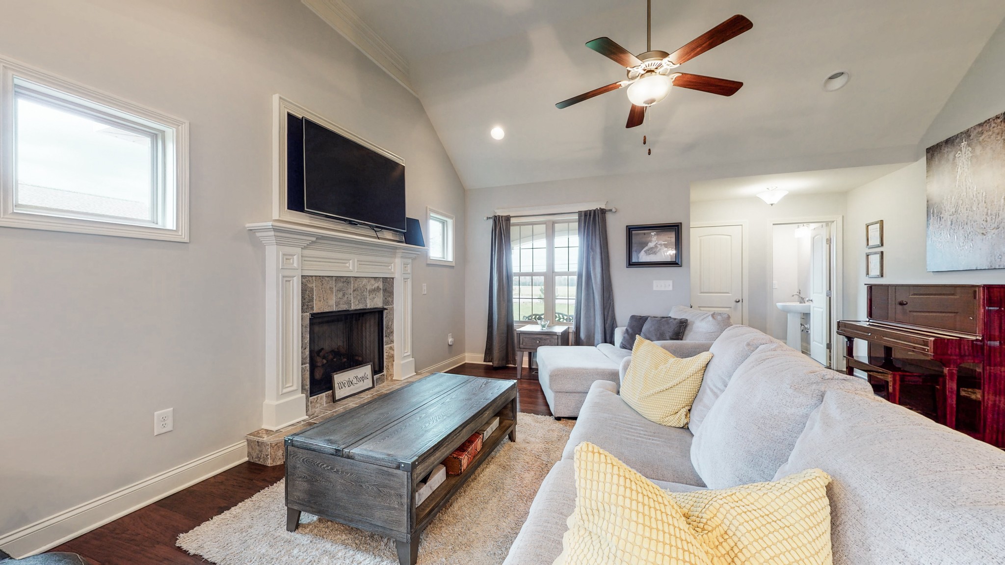 6620 Murfreesboro Road Lebanon, TN 37090 - Photo 6 of 55 a living room with furniture a fireplace and a flat screen tv