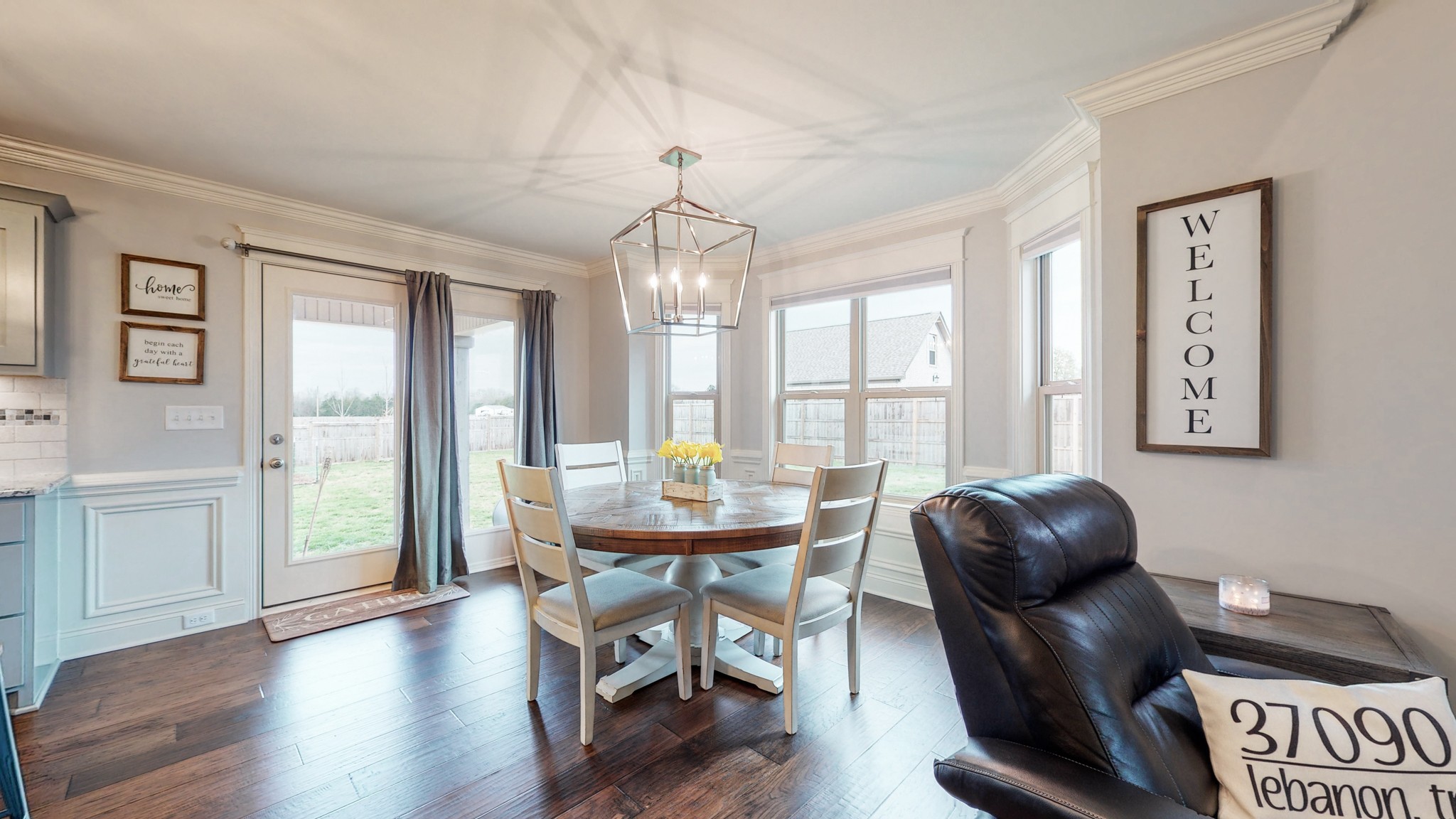 6620 Murfreesboro Road Lebanon, TN 37090 - Photo 7 of 55 a dining room with furniture a chandelier and wooden floor
