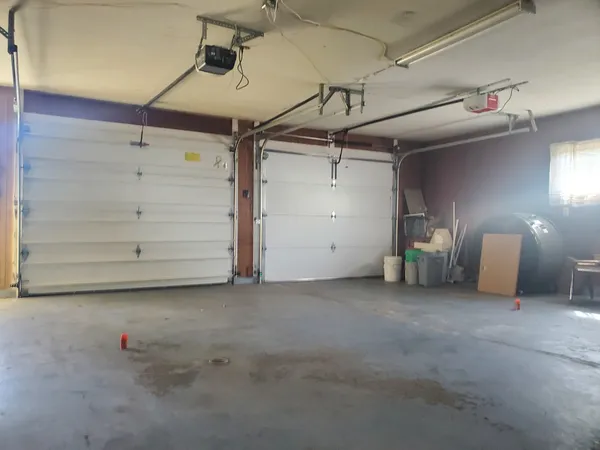 a view of an empty room with a fireplace