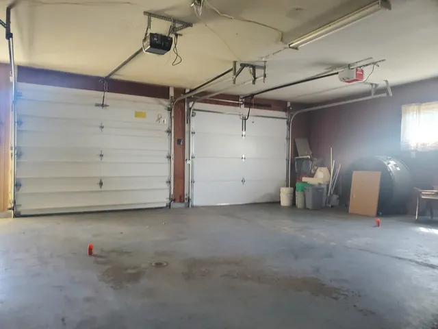 a view of an empty room with a fireplace