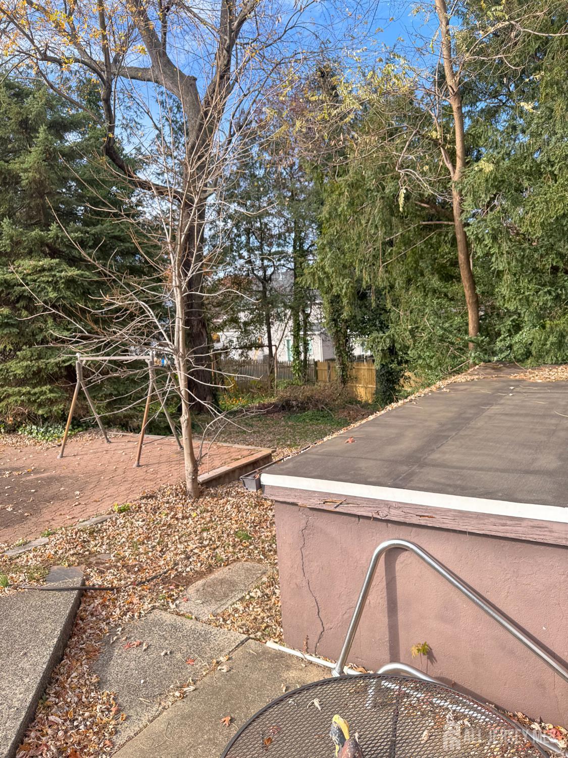 145 Dover Road Colonia, NJ 07067 - Photo 12 of 12 a view of a yard with wooden fence