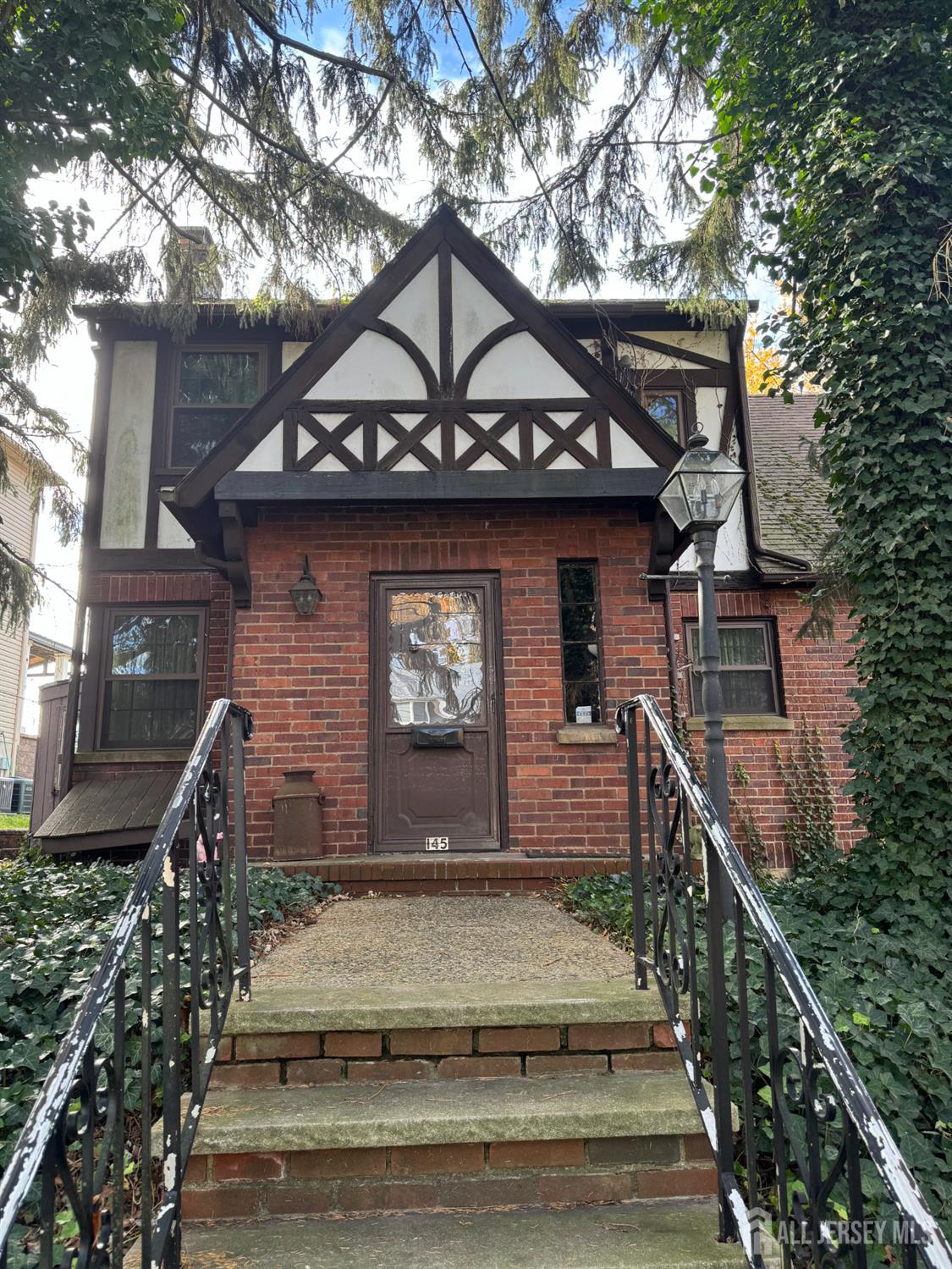145 Dover Road Colonia, NJ 07067 - Photo 2 of 12 a front view of a house with garden