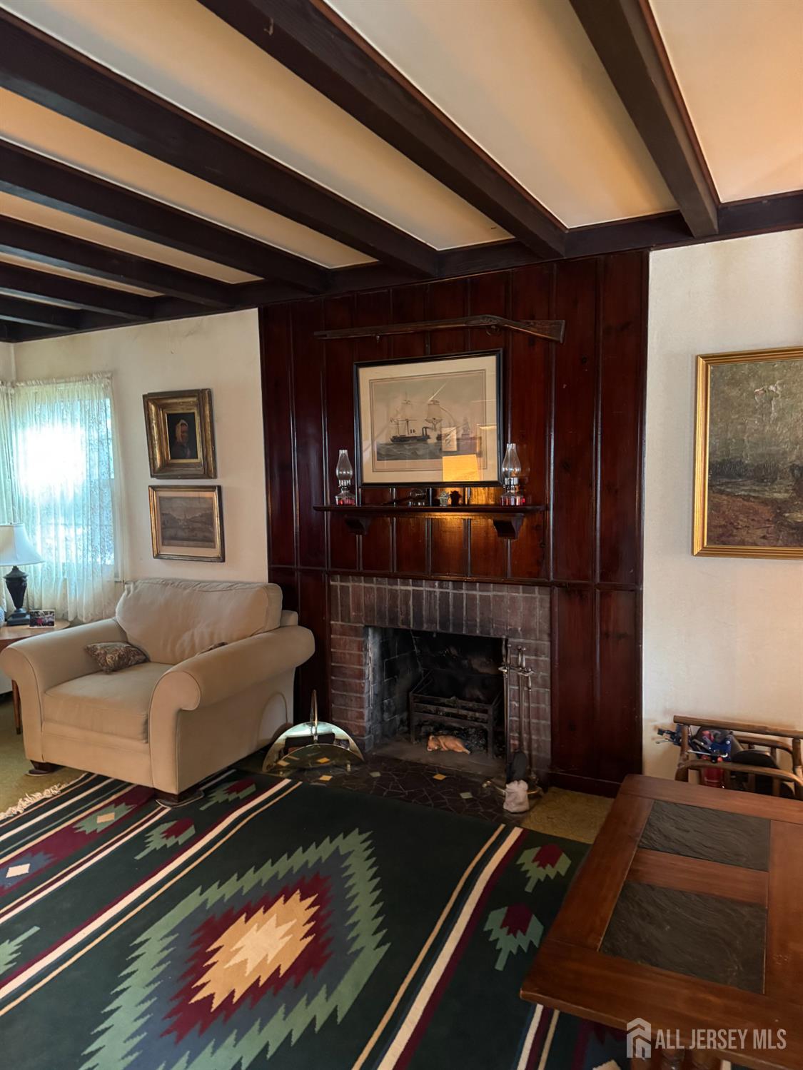 145 Dover Road Colonia, NJ 07067 - Photo 7 of 12 a living room with furniture and a fireplace