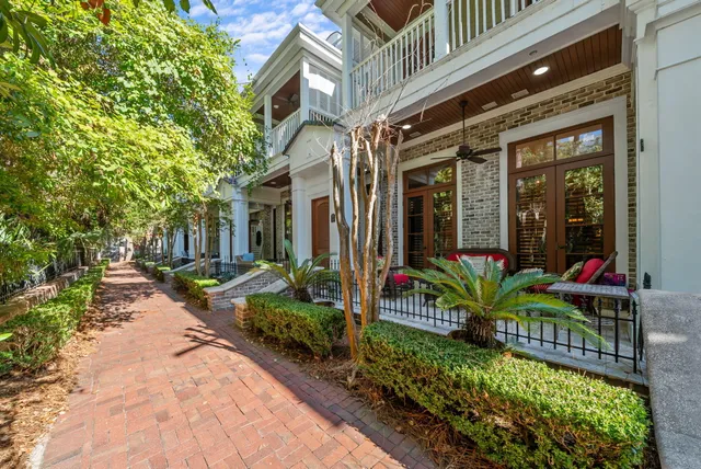 a view of a house with sitting area and garden