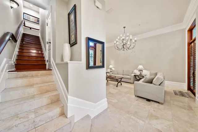 a kitchen with stainless steel appliances granite countertop a sink a stove and a window