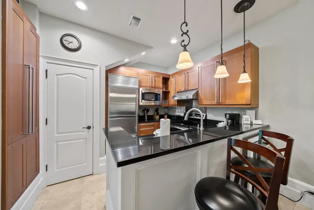 a bedroom with a bed and a fireplace