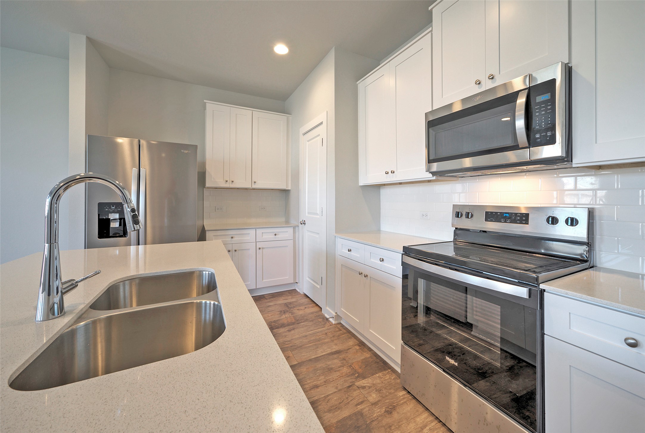 2312 Castillo Drive Round Rock, TX 78664 - Photo 9 of 21 a kitchen with stainless steel appliances granite countertop a sink and a stove top oven with granite countertops