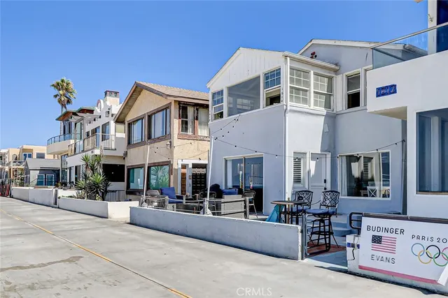 a building outdoor space with patio furniture and potted plants