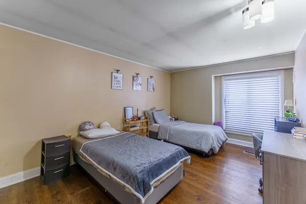 a bedroom with two beds and painted walls