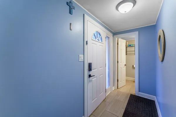 a bathroom with a sink mirror and toilet
