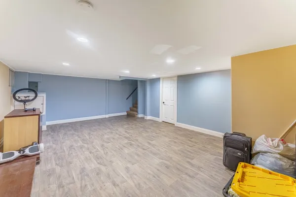 a view of a room with gym equipment and a large window