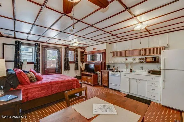 a bed room with furniture and balcony