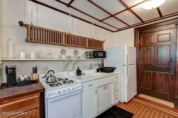 a kitchen with stainless steel appliances granite countertop a stove and a refrigerator