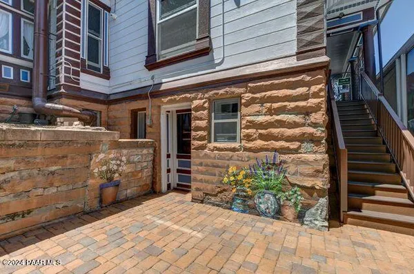 a view of a building with potted plants