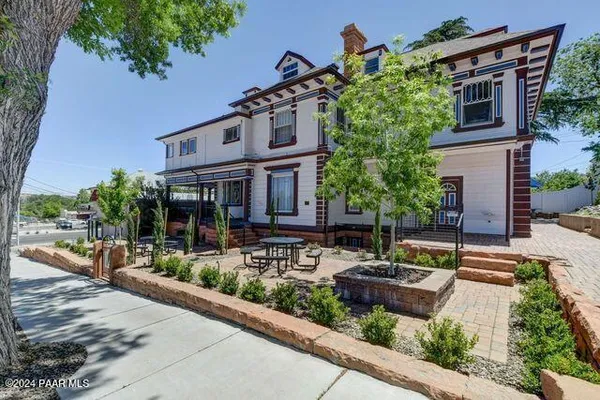 a view of a chairs with a table in patio