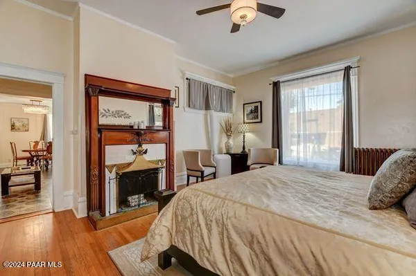 a bedroom with a bed and a fireplace