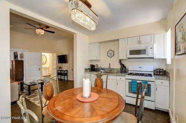 a kitchen with a stove a sink and a refrigerator
