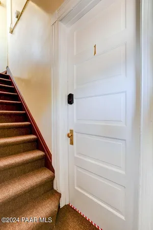 a view of staircase with white walls