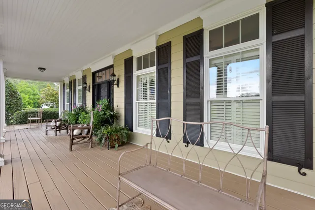 a living room with furniture fireplace and a flat screen tv