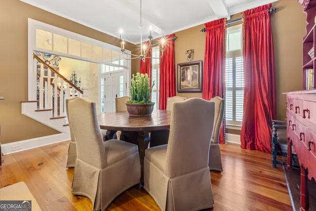 a kitchen with stainless steel appliances granite countertop a kitchen island a stove and a sink