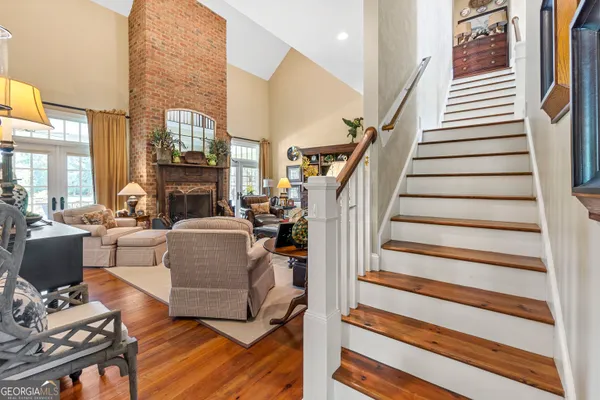 a view of a dining room with furniture and window