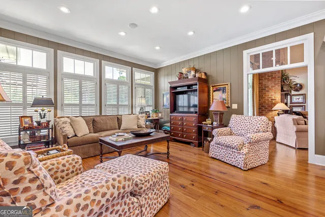 a bed room with a bed and a chandelier