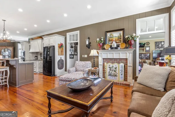 a bedroom with furniture and wooden floor