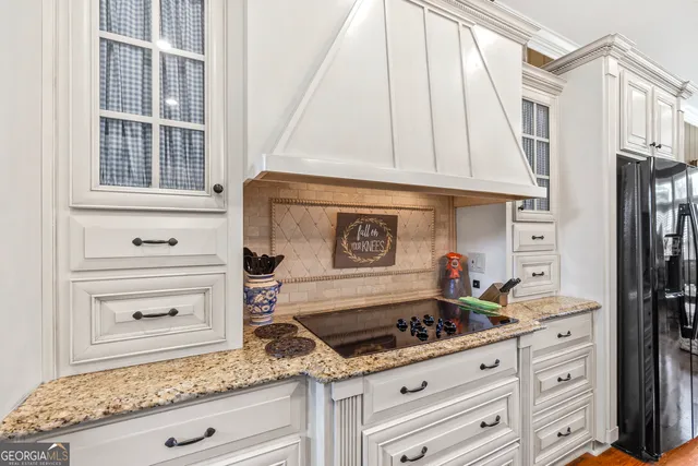 a bed room with a bed and painting on the wall