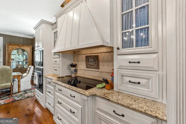 a livingroom with workspace and a couch