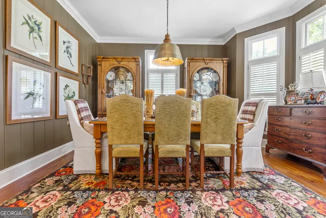 a view of a house with backyard and patio
