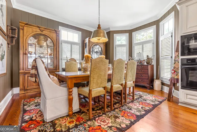 a front view of a house with garden and patio