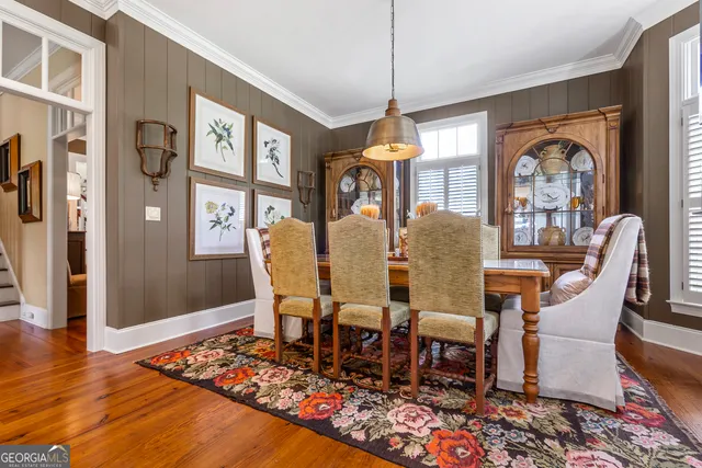 a view of a patio with a dining table and chairs