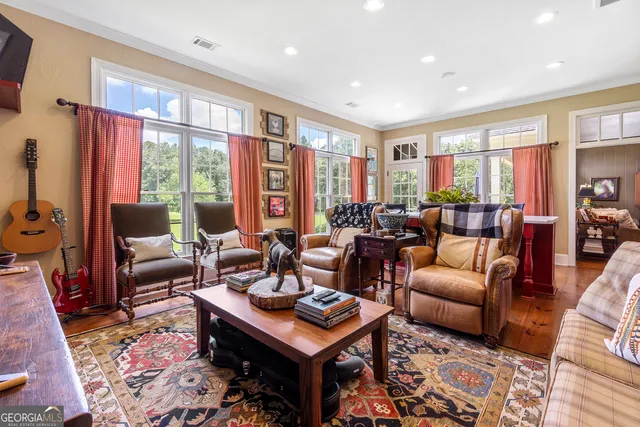 a front view of house with yard and trees in the background