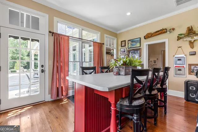 an aerial view of a house with swimming pool a yard and outdoor seating
