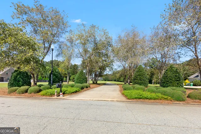 a front view of a house with garden and porch