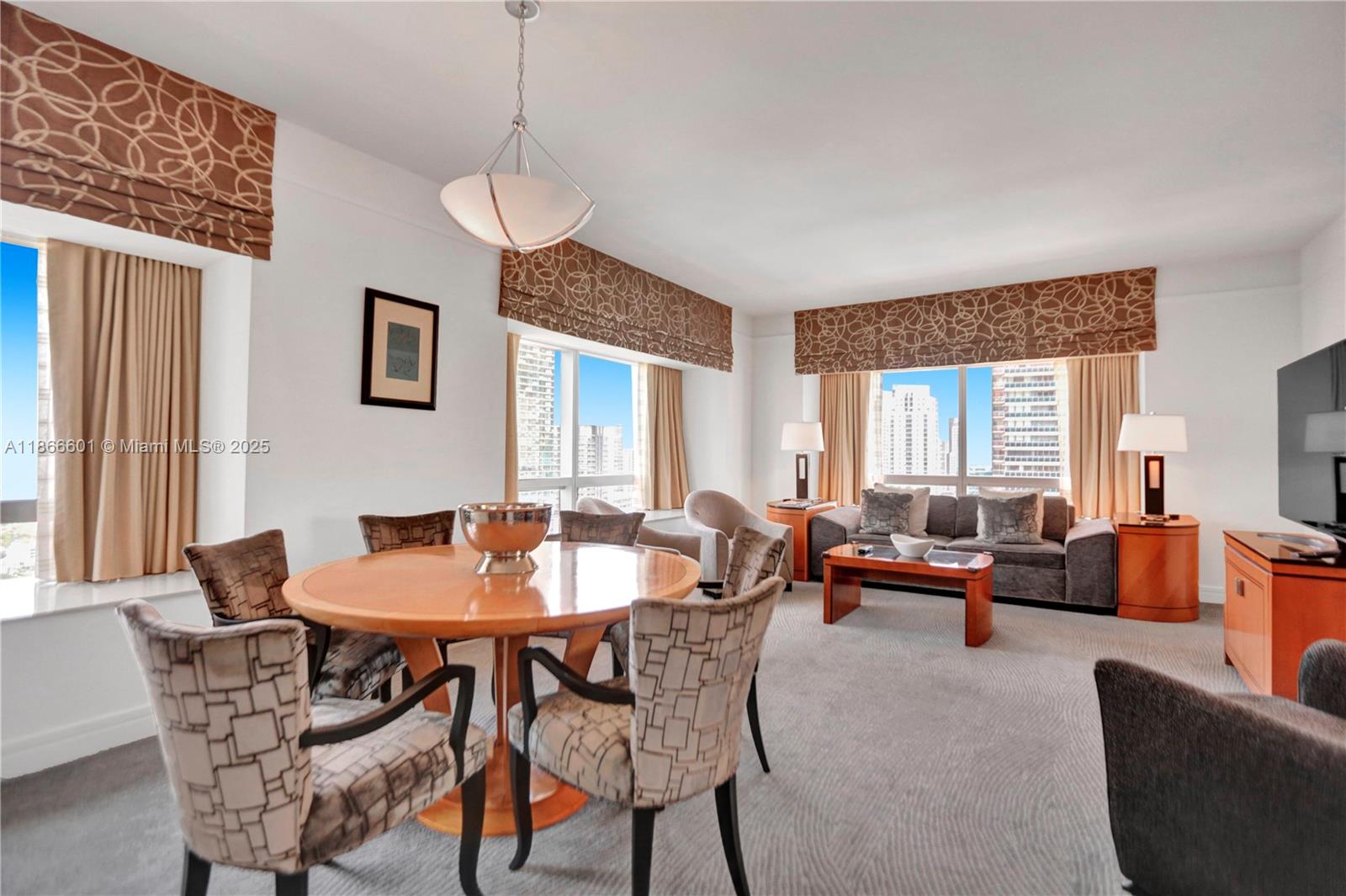 a dining room with furniture and window