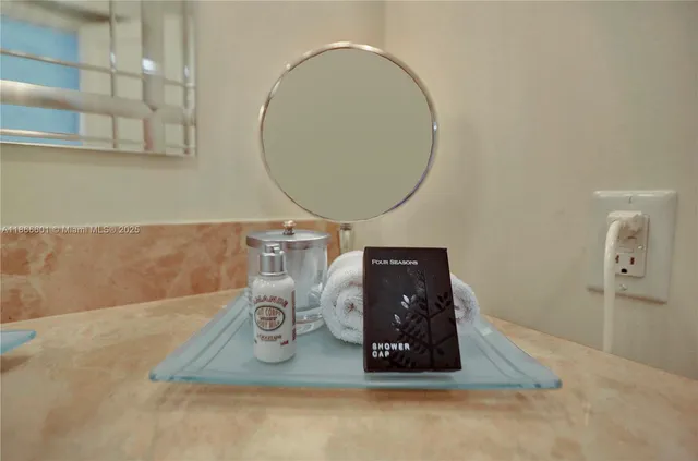a bathroom with a mirror and a sink