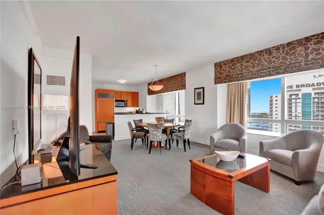 a living room with furniture and a large window