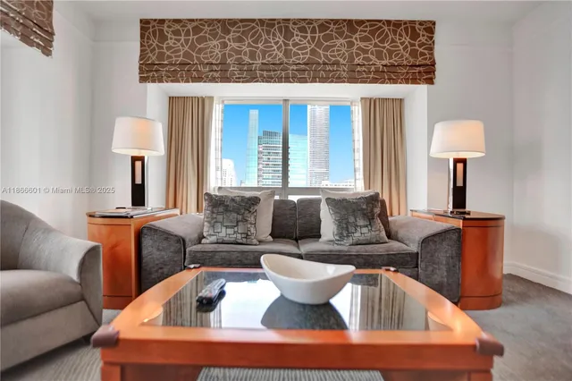 a living room with furniture and a large window