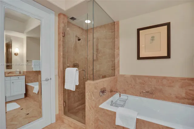 a bathroom with a tub shower and sink