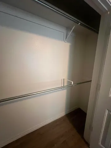 a view of an empty walk in closet