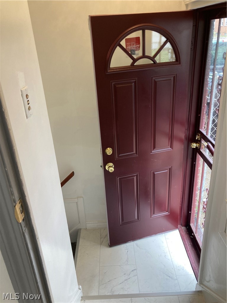 3800 Strandhill Road Cleveland, OH 44128 - Photo 24 of 34 Entrance to side door with light tile patterned floors and plenty of natural light